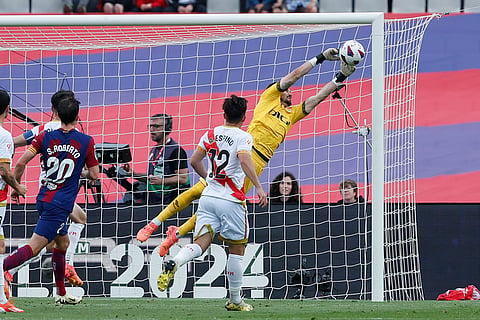 Rayo's goalkeeper Stole Dimitrievski makes a save